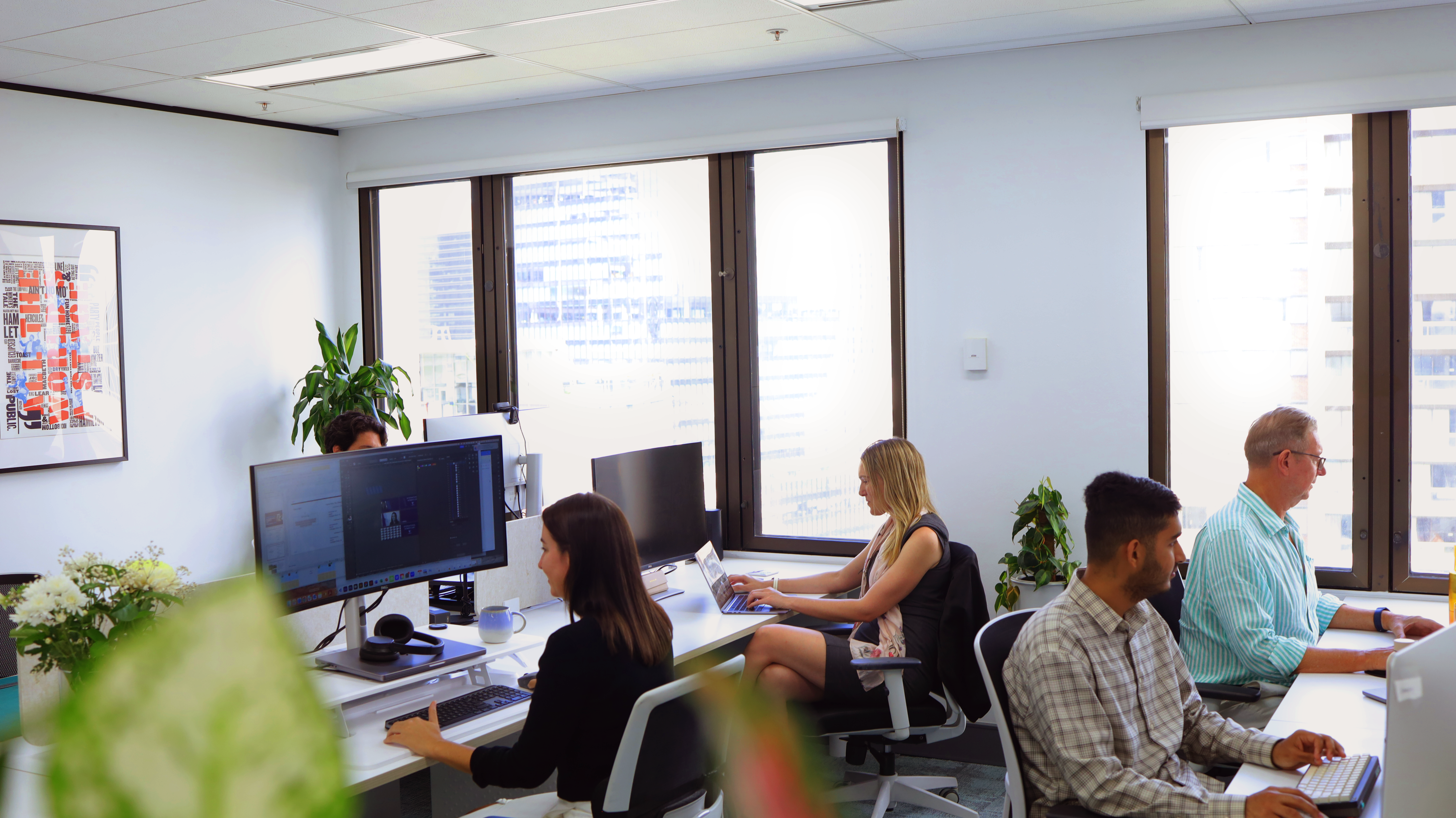 Sydney Advertising Agency team at work in new office.